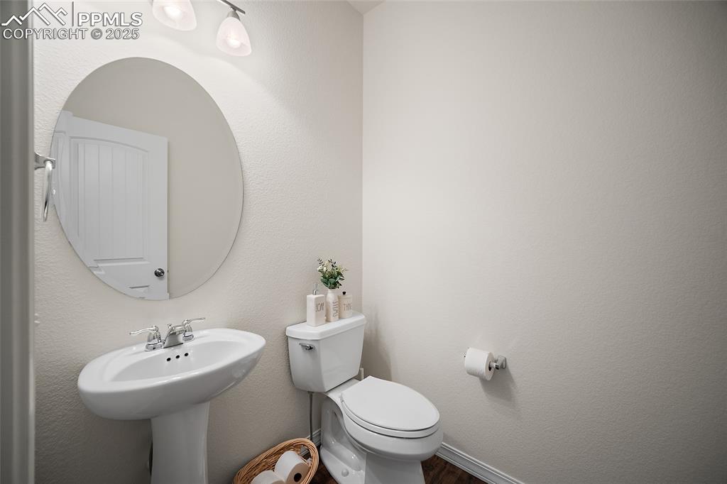 Image 41 of 50: Powder room in the lower level.