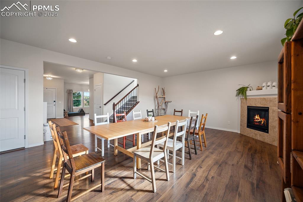 Image 6 of 50: Gas fireplace with luxury vinyl plank flooring.