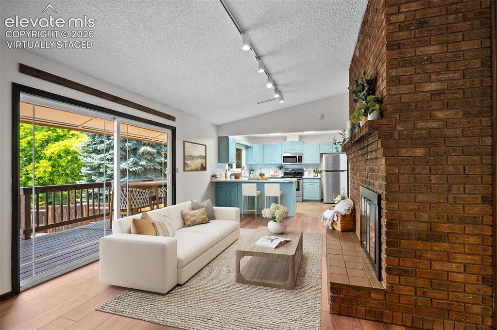 Image 10 of 50: Virtually Staged; Upper Den & Kitchen