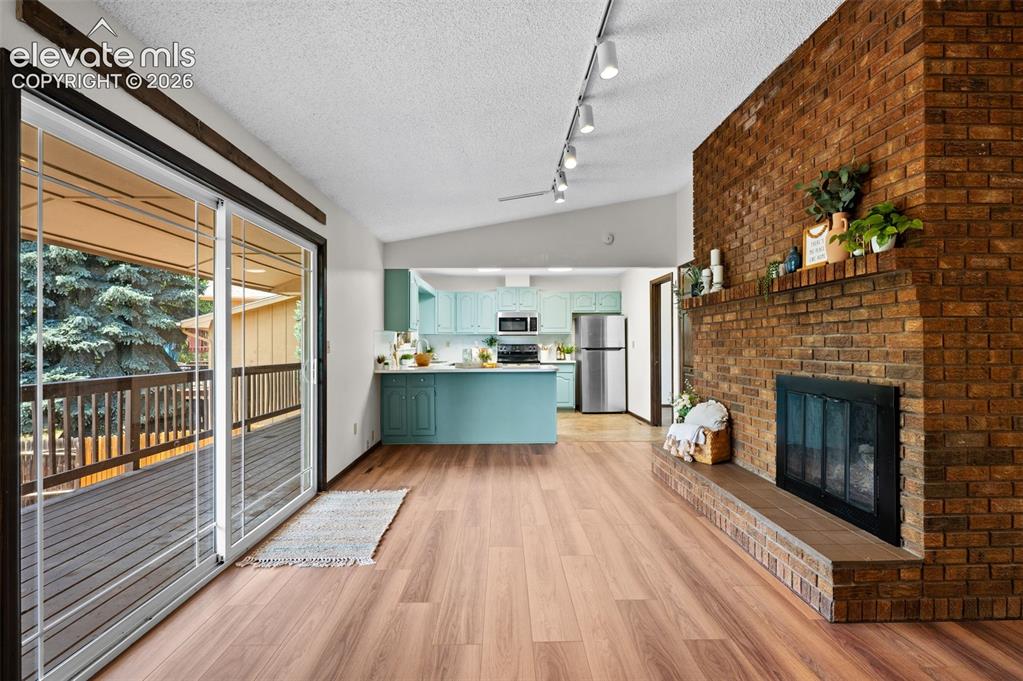 Image 11 of 50: Upper Den & Kitchen