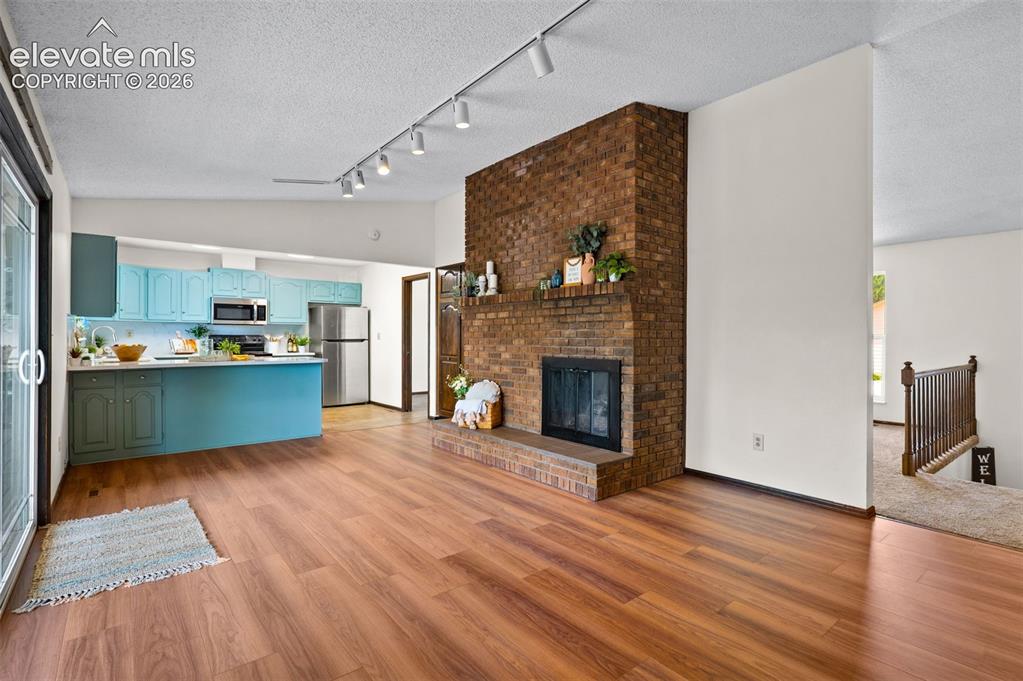 Image 12 of 50: Upper Den & Kitchen