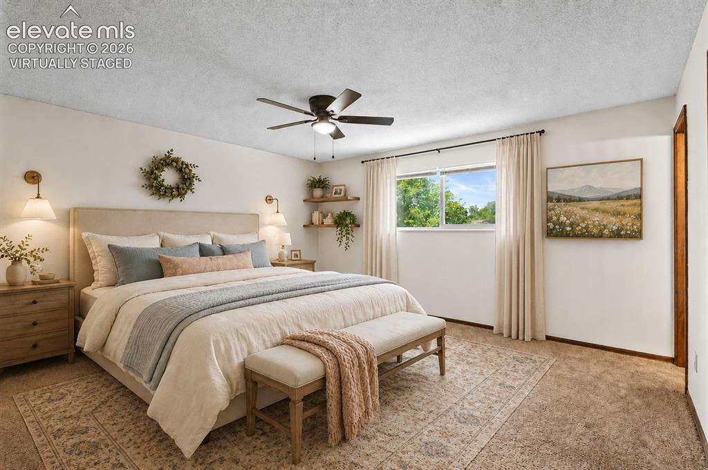 Image 19 of 50: Virtually Staged; Primary Bedroom Suite; Sconces & window dressings not pre