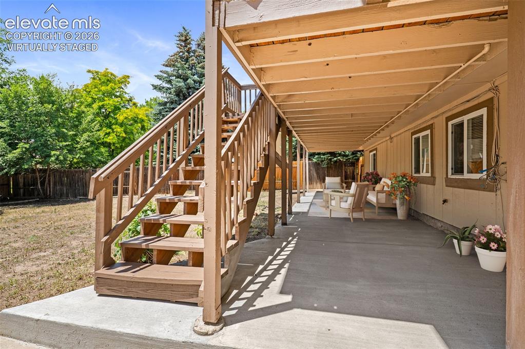 Image 34 of 50: Virtually Staged; Lower Covered Patio