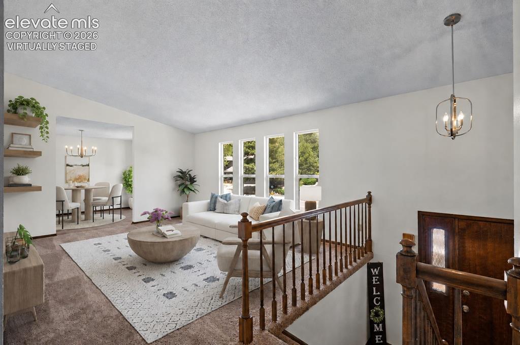 Image 4 of 50: Virtually Staged; Entry, Front Living Room, & Dining