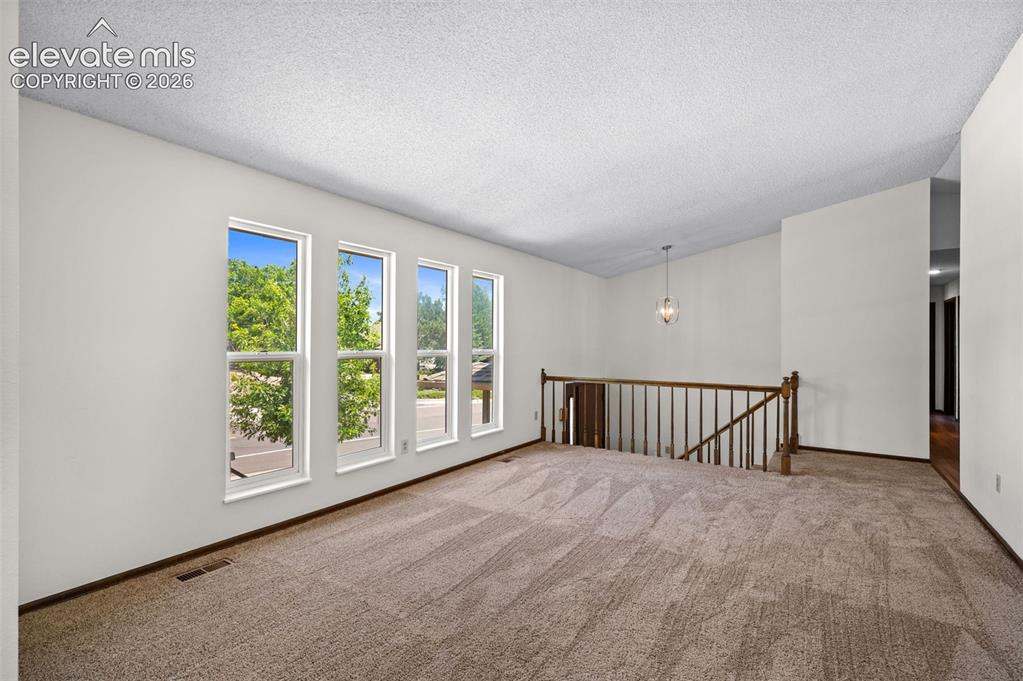 Image 7 of 50: Entry & Front, Upper Living Room