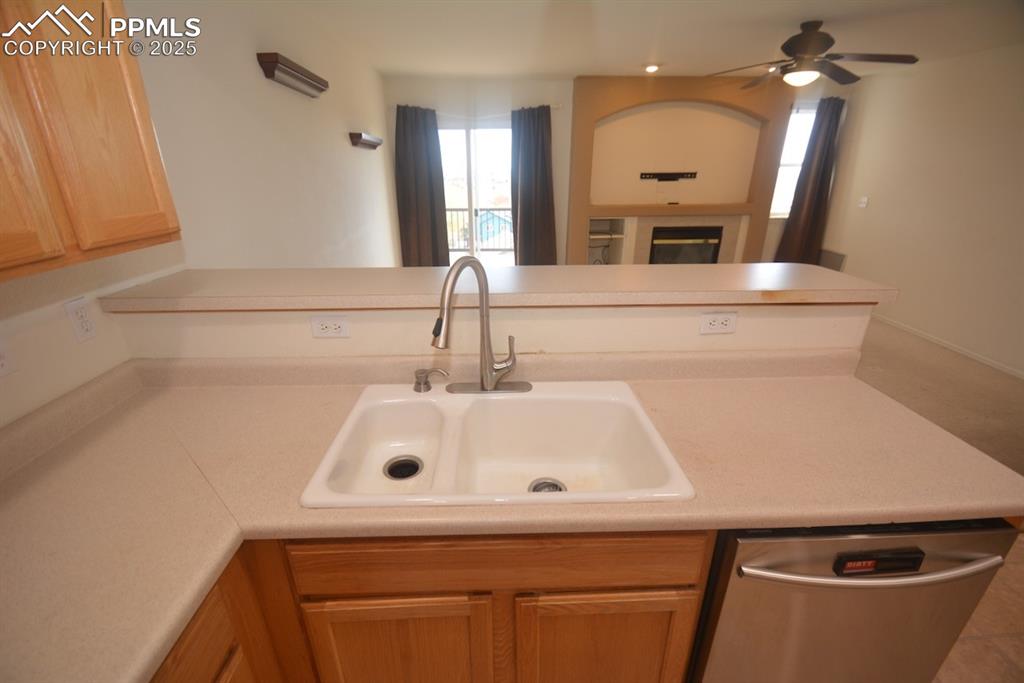 Image 22 of 48: kitchen sink looking into family room.