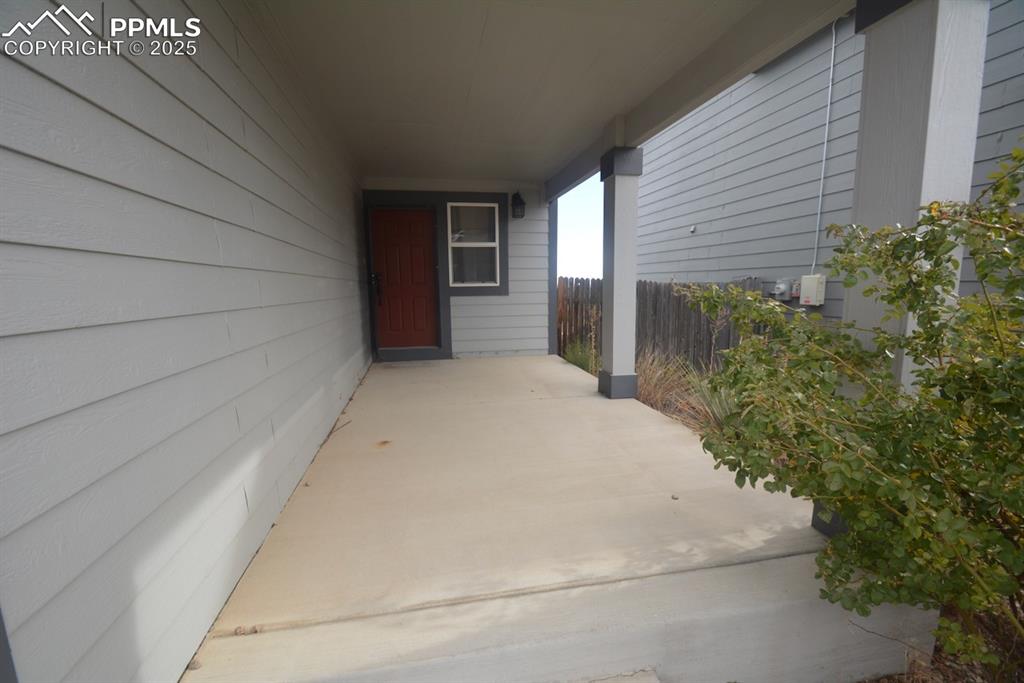Image 3 of 48: Covered front patio