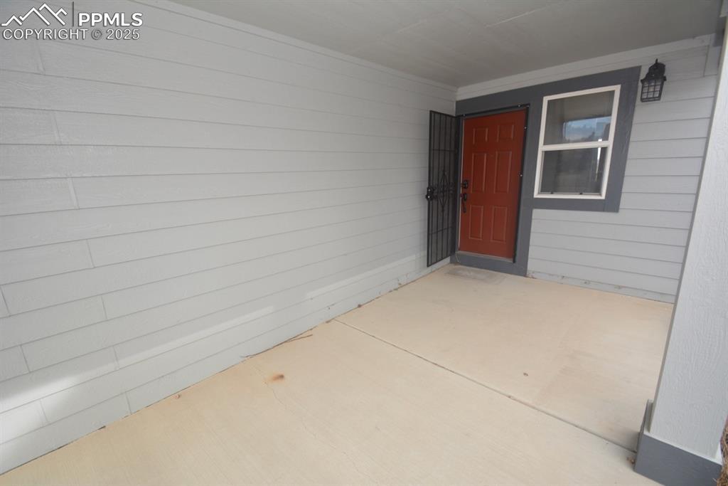 Image 4 of 48: covered front patio