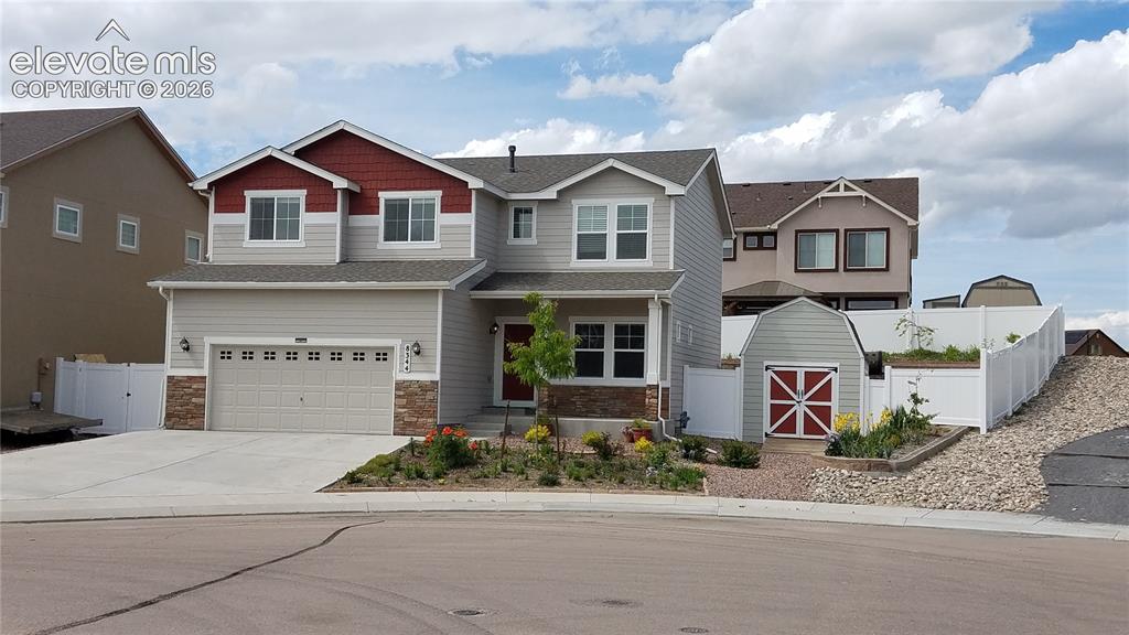 Image 32 of 32: Two-story home featuring a combination of siding and stone veneer exterior
