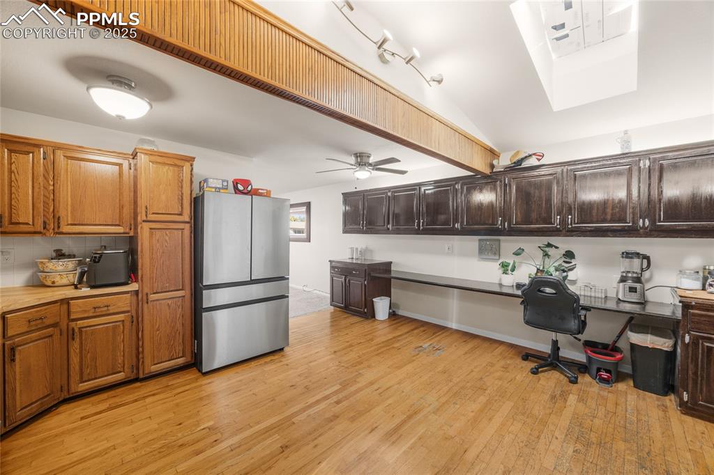 Image 5 of 15: Kitchen with freestanding refrigerator, light wood-style flooring, a ceilin
