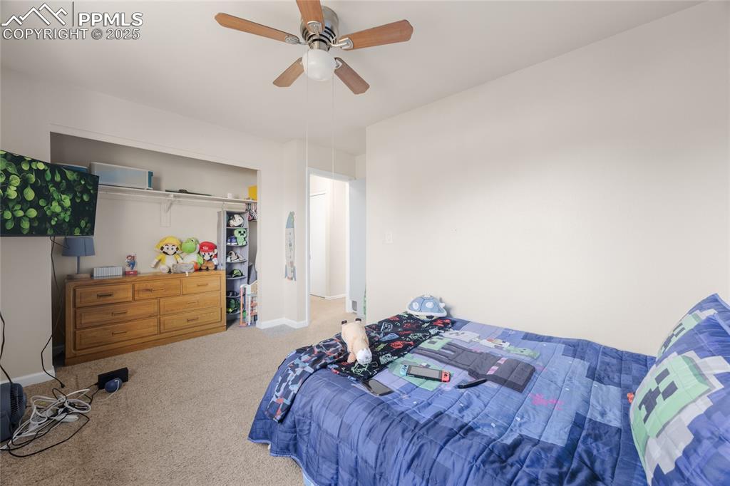Image 9 of 15: Bedroom featuring carpet floors and ceiling fan