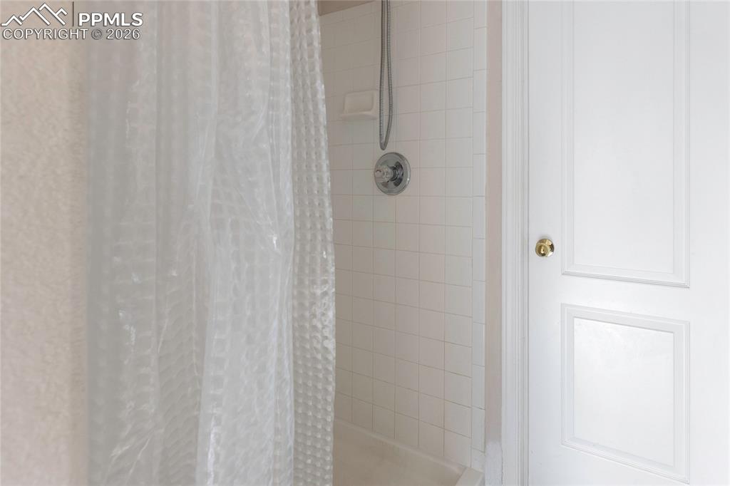 Image 18 of 37: Bathroom view of tiled shower