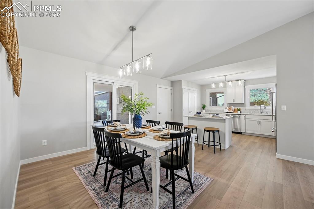 Image 11 of 50: Dining room with walk-out to back deck