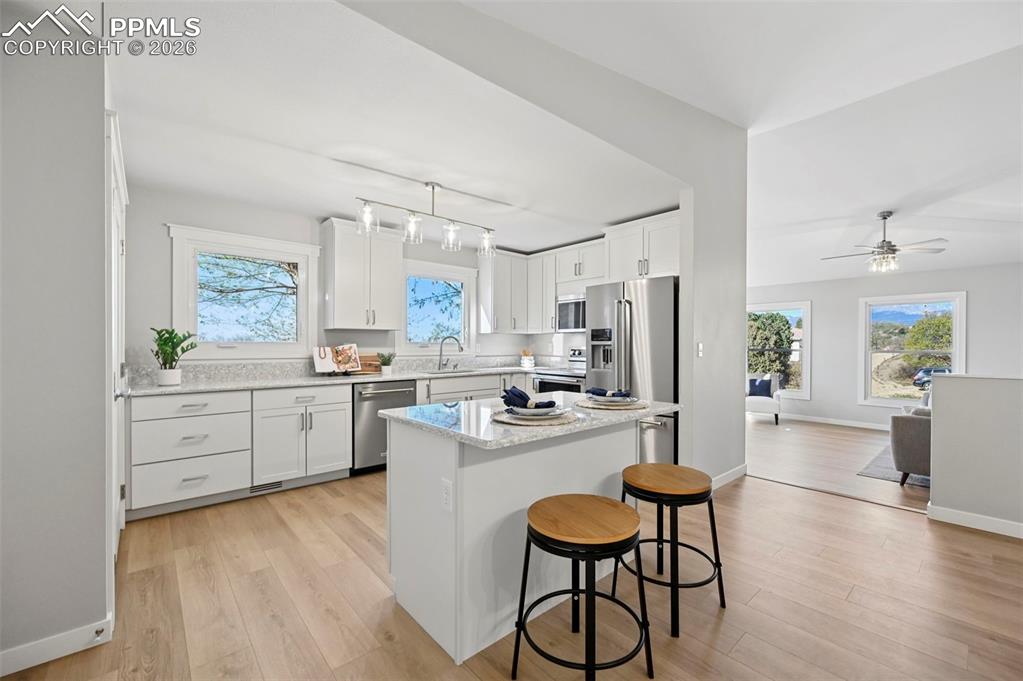 Image 12 of 50: island for seating and meal prep