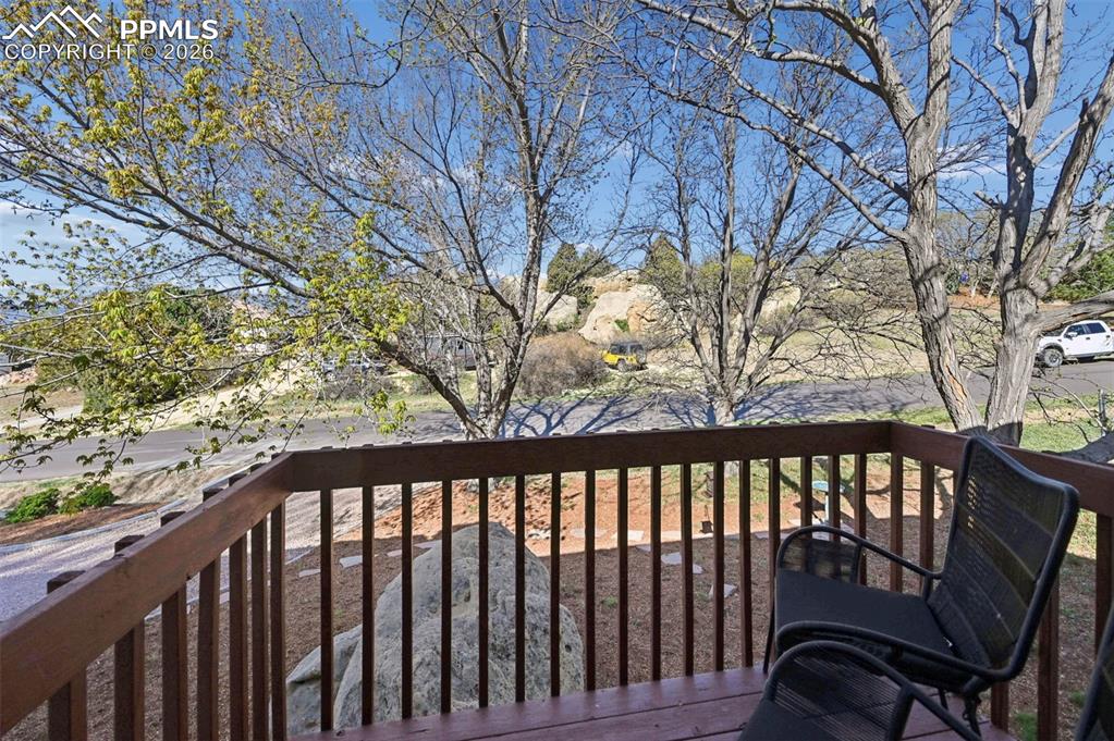 Image 20 of 50: Primary bedroom walk-out deck with west facing views 