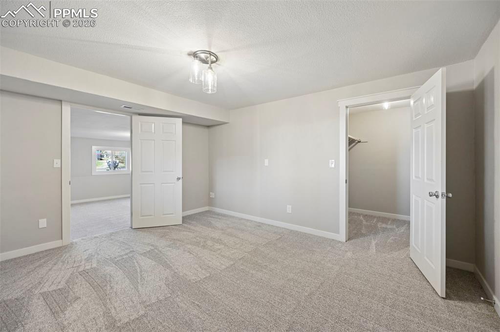 Image 33 of 50: 5th bedroom w/walk-in closet - basement