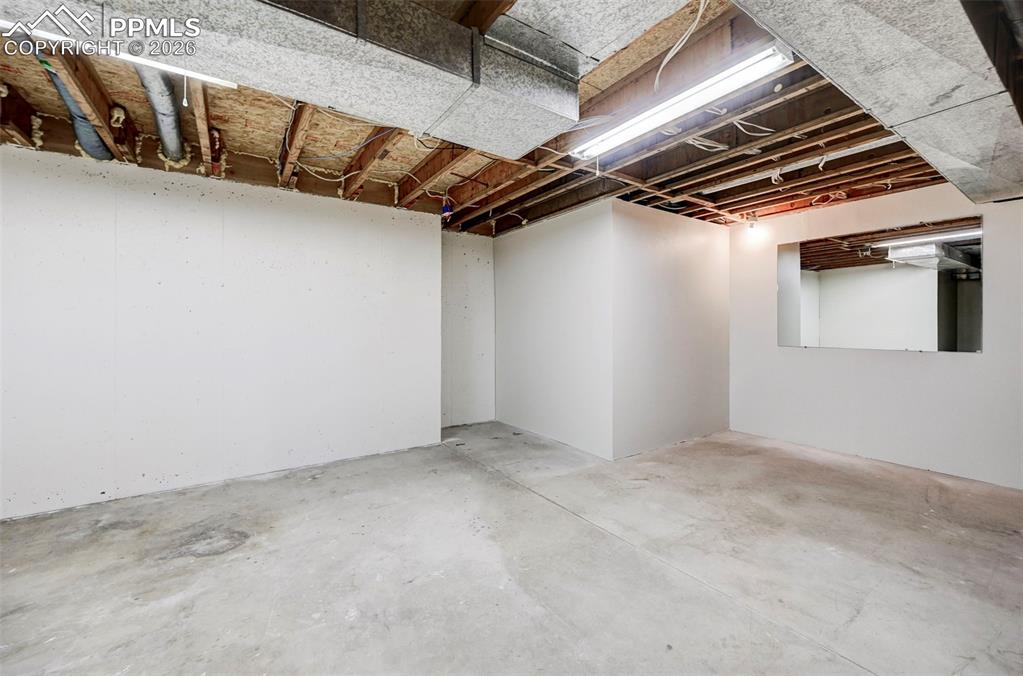 Image 34 of 50: large unfinished area in basement for storage / utility room