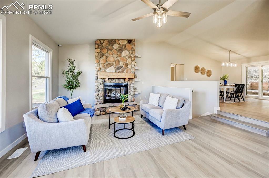 Image 5 of 50: Gar fireplace in large open living room
