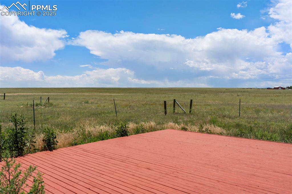 Image 22 of 34: Deck featuring a rural view