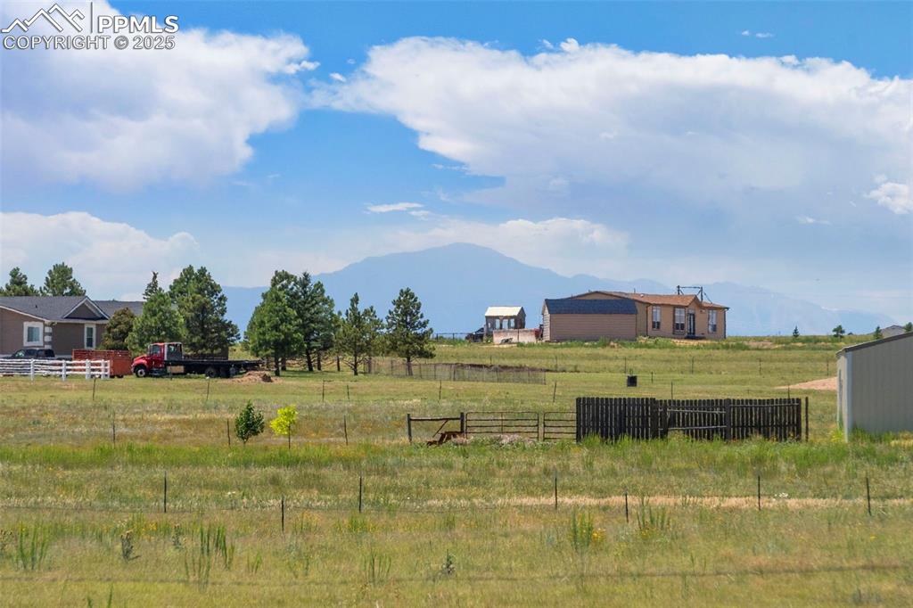 Image 24 of 34: View of yard with a rural view and a mountain view
