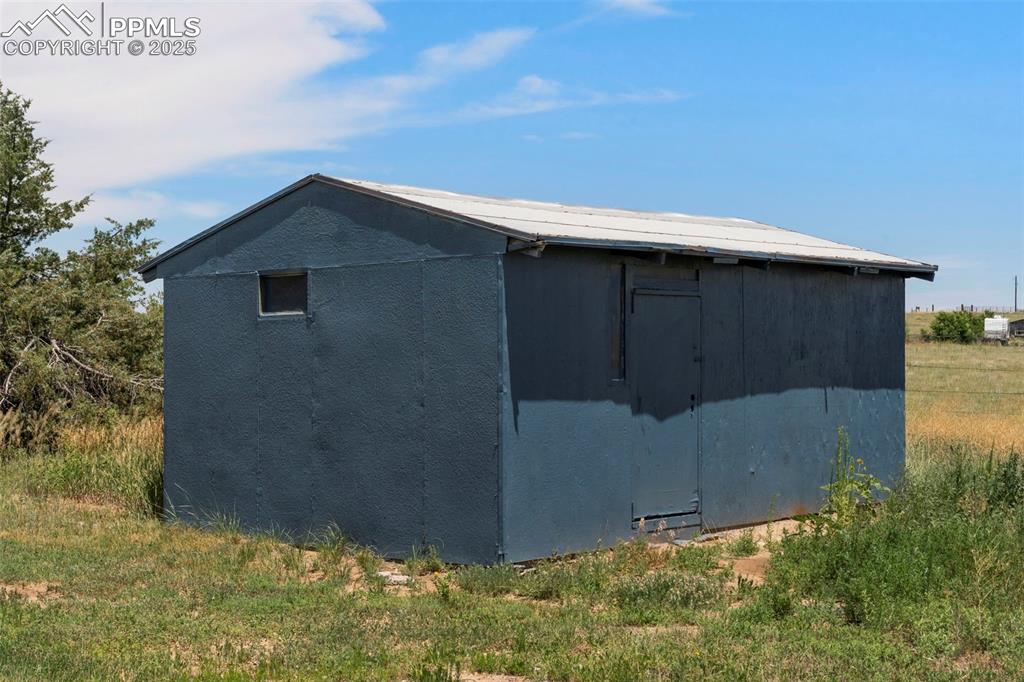 Image 28 of 34: View of property exterior featuring a storage unit