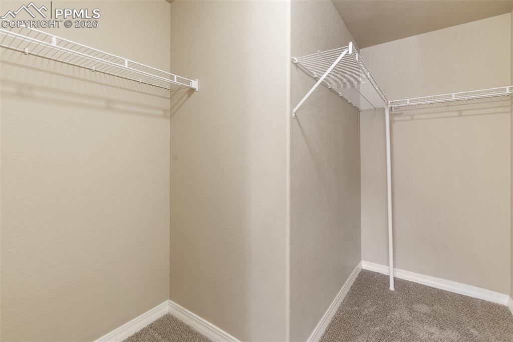 Image 15 of 26: Primary closet