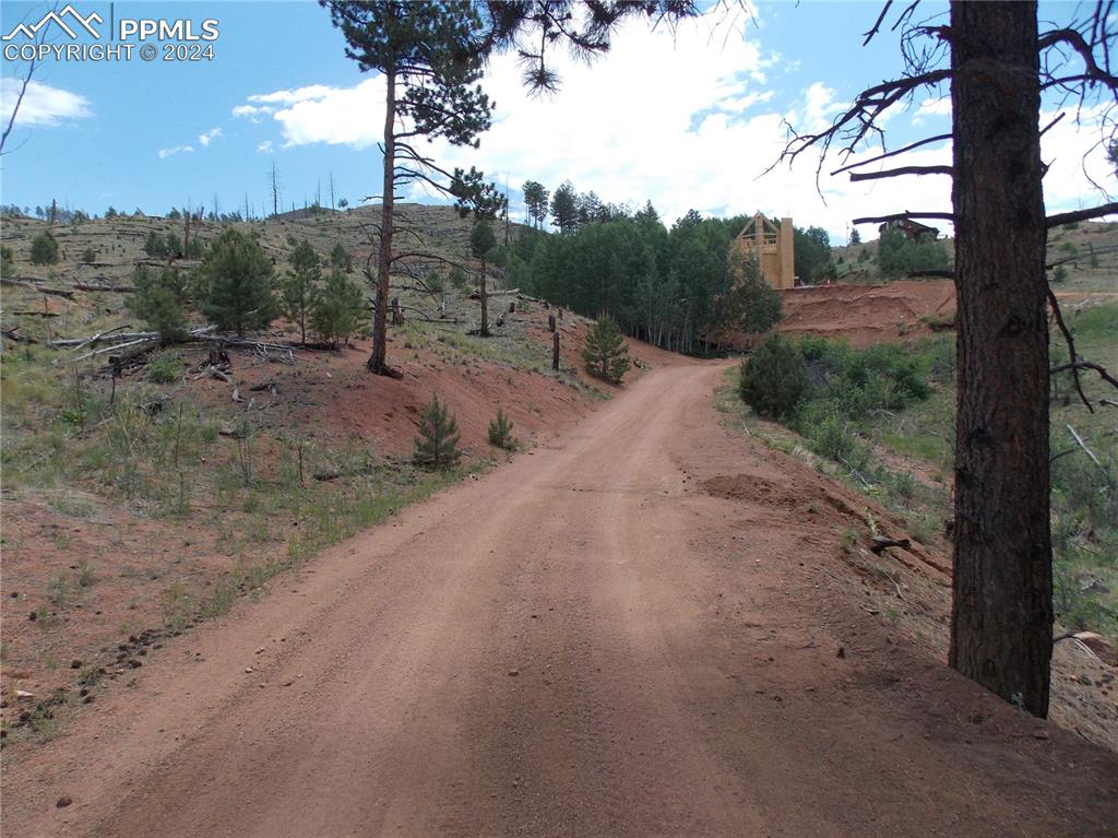 Image 5 of 19: Lot is to the left of the road.