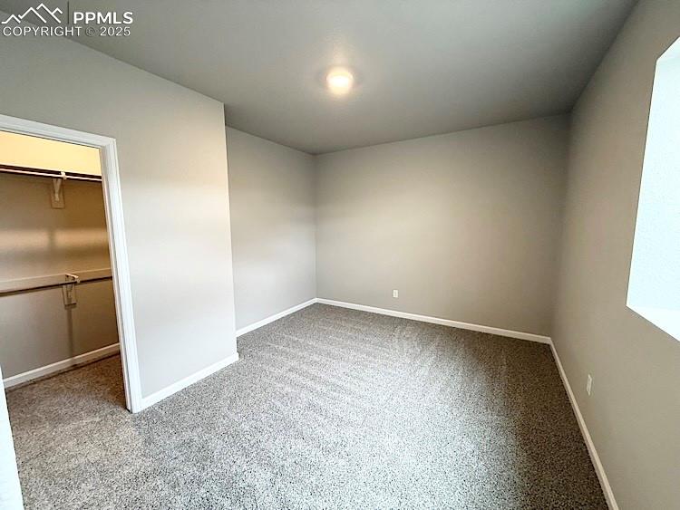 Image 21 of 30: 3rd Bedroom, with a walk-in closet, located on the lower level!