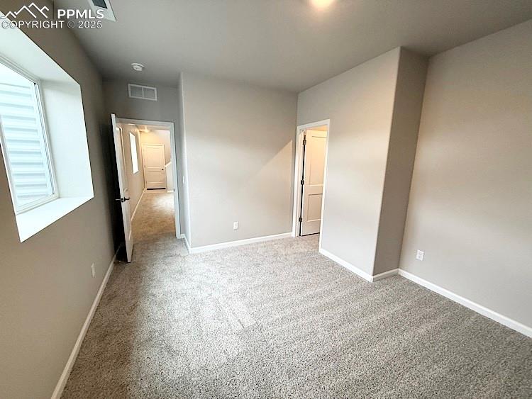 Image 22 of 30: 3rd Bedroom, with a walk-in closet, located on the lower level!