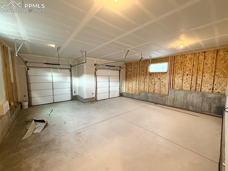 Image 42 of 46: 2 Car Tuck Under Alley Garage!