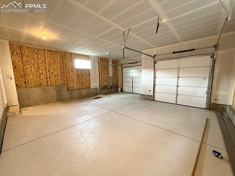 Image 43 of 46: 2 Car Tuck Under Alley Garage!