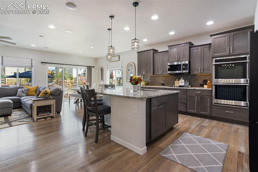 Image 4 of 41: Spacious kitchen with oversized island and double ovens