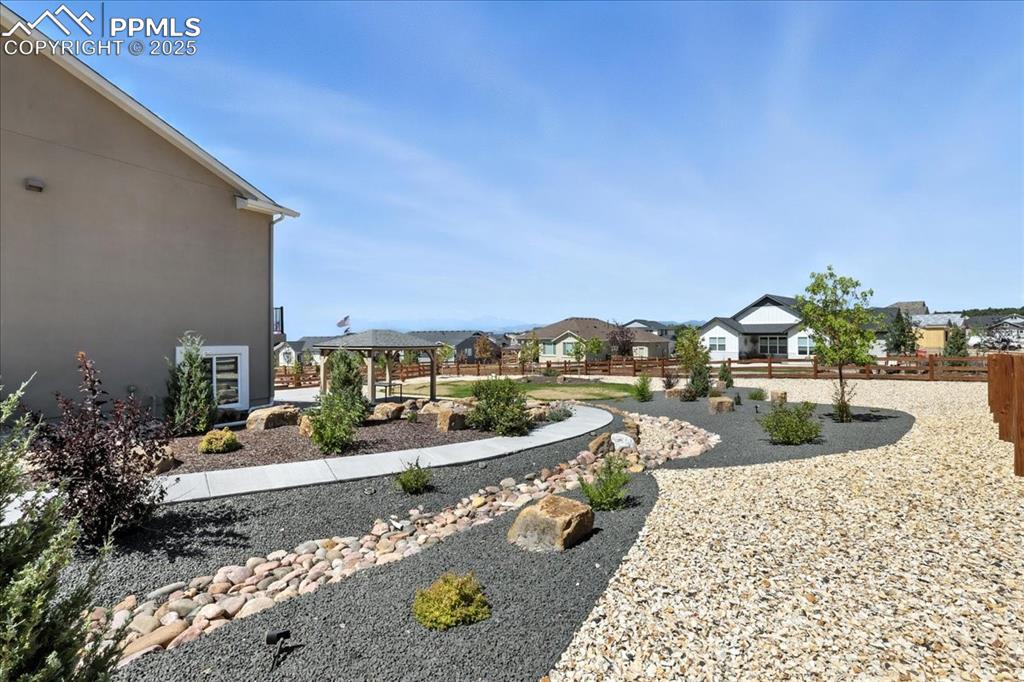 Image 39 of 50: View of yard with a gazebo and a residential view
