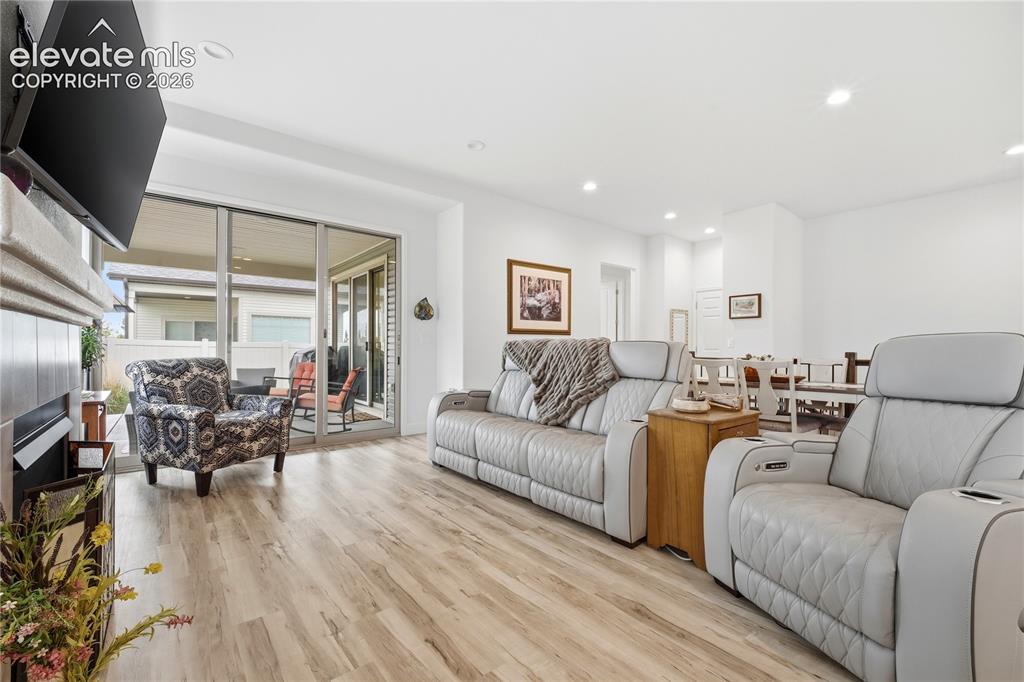 Image 16 of 50: Walk out to patio from Living Room