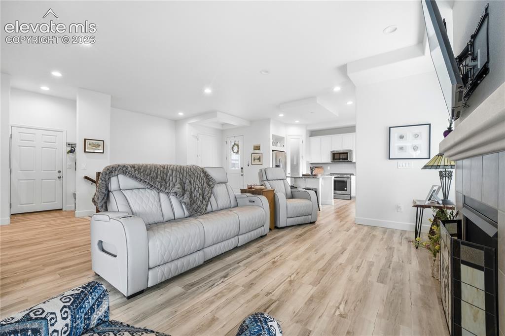 Image 17 of 50: Open-concept living area free flowing to kitchen and dining.