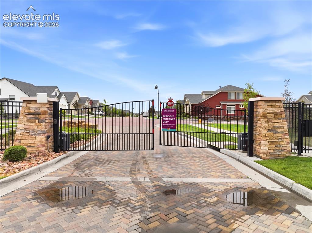 Image 48 of 50: Gated community residence entrance