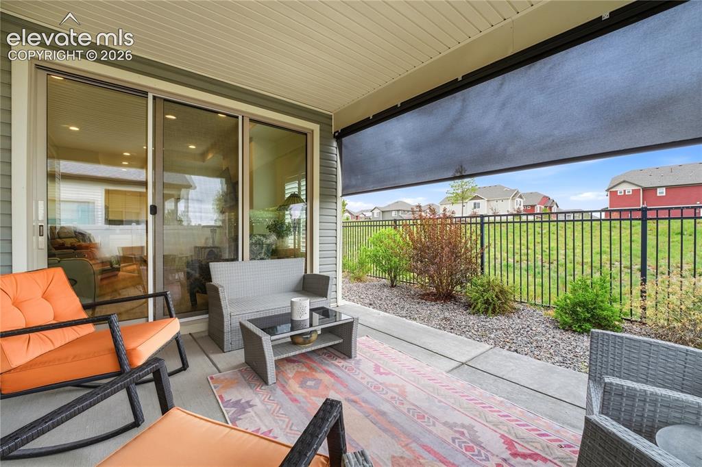 Image 5 of 50: Roller shade privacy screen and no home behind you.