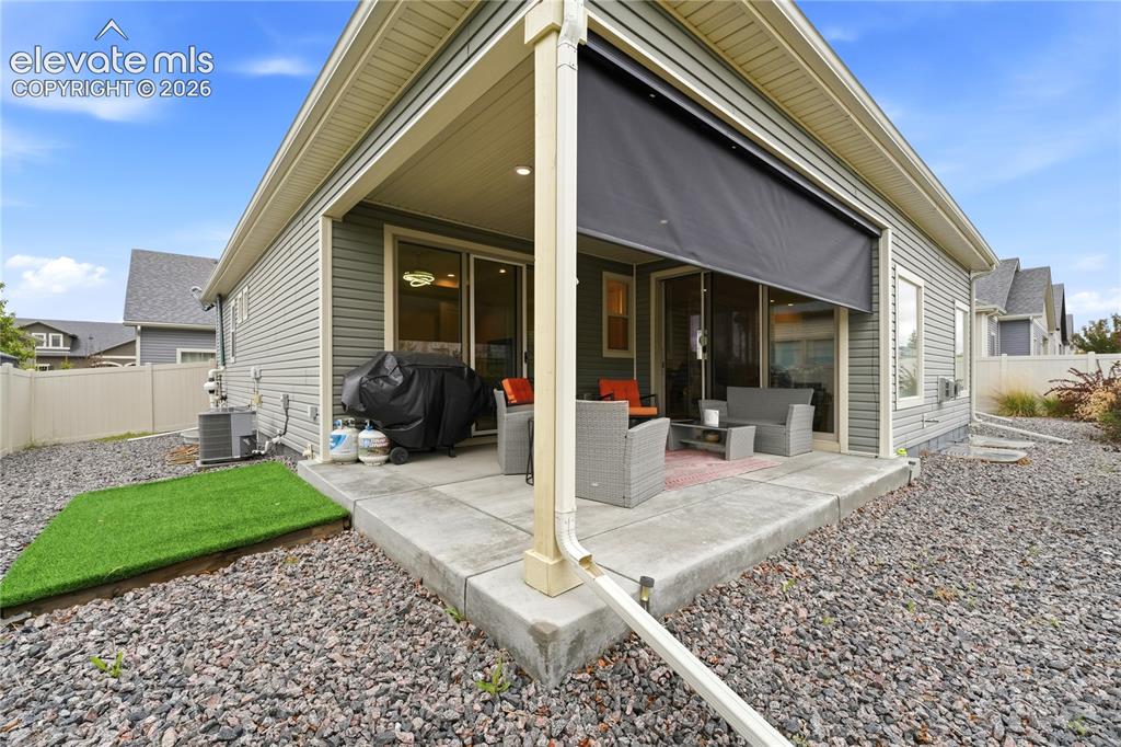 Image 7 of 50: Covered concrete patio with no home behind you.