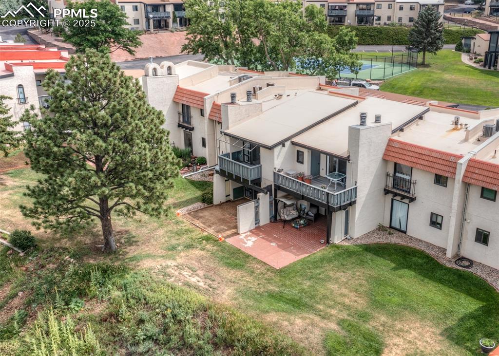 Caption: Balcony view of Garden of the Gods and Pikes Peak. Pine tree is adjacent ot unit
