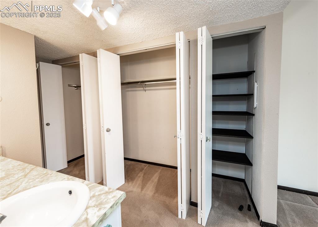 Image 27 of 40: Towel pantry and closet in master bathroom