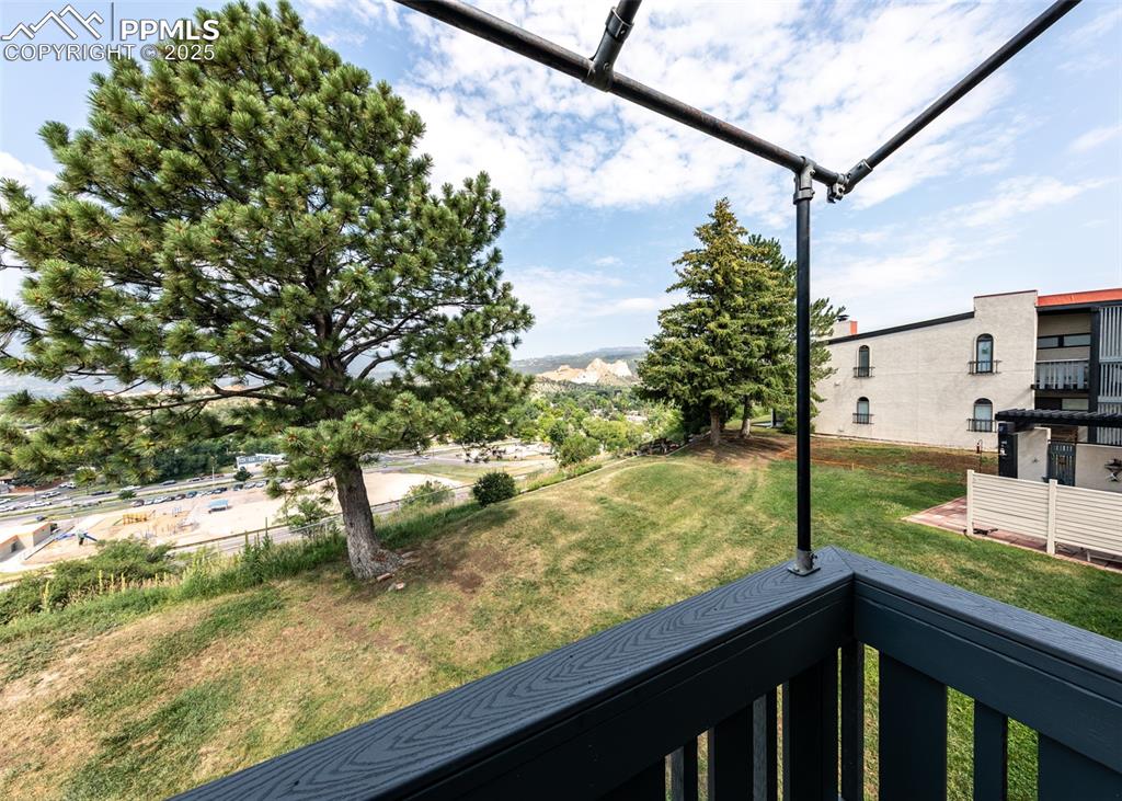 Image 4 of 40: View of green lawn featuring a balcony