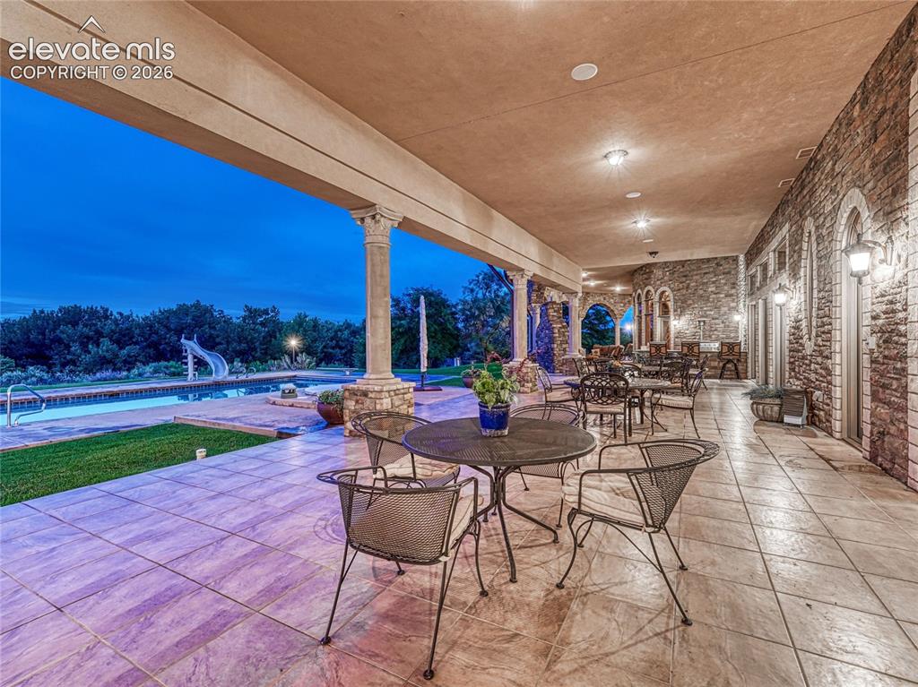Image 10 of 50: One of multiple outdoor, covered terrace spaces to enjoy.