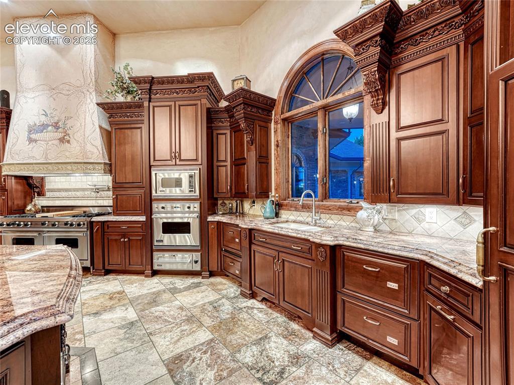 Image 13 of 50: 6 dishwasher drawers, 2 sinks, 4 ovens, microwave, ice maker, subzero frig