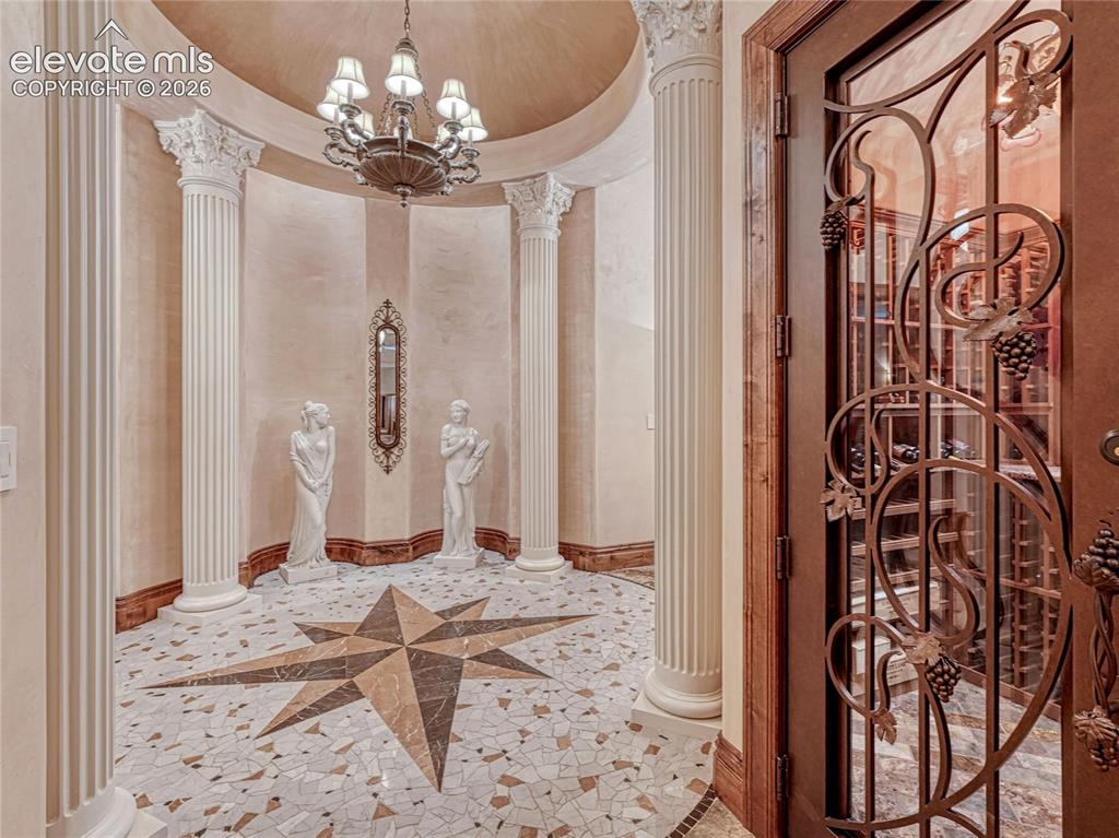 Image 19 of 50: Custom metal door to wine room.