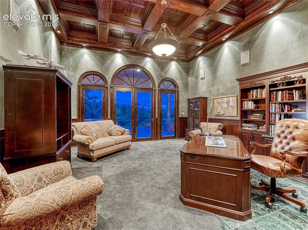 Image 24 of 50: Office space is one of two rooms with a magnificent coffered ceiling.