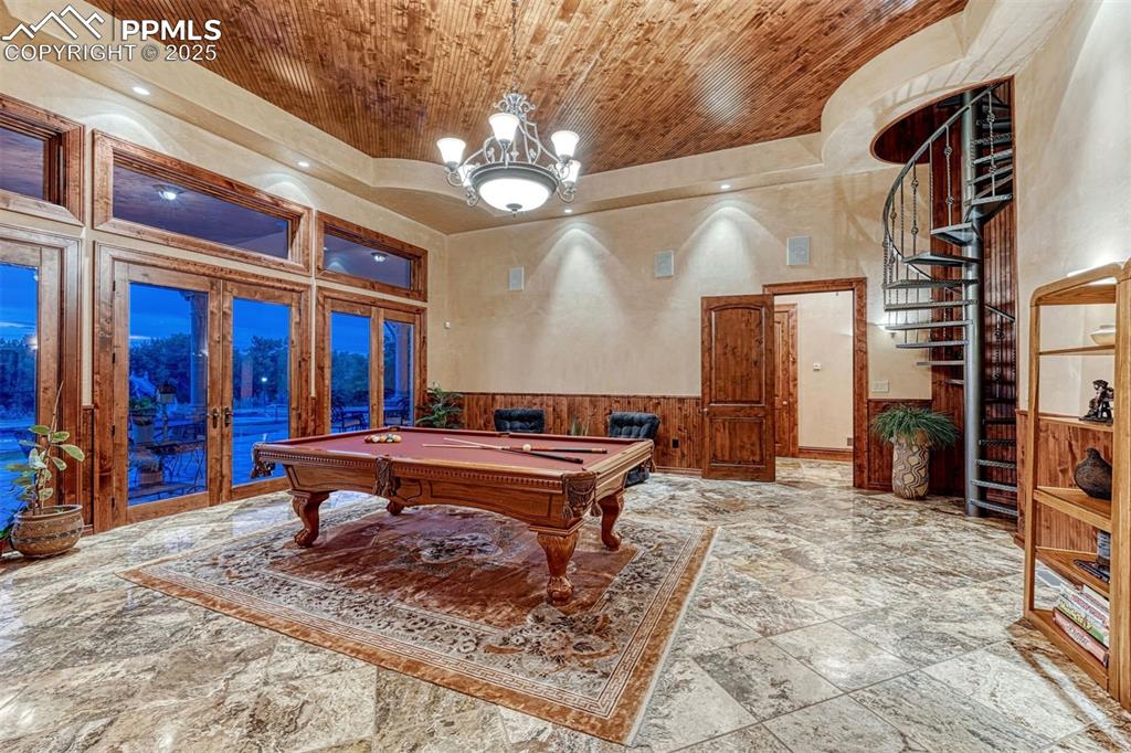 Image 33 of 50: Fitness space is one of two rooms with magnificent coffered ceiling.