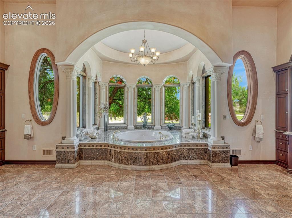 Image 6 of 50: Primary ensuite has two showers, separate tub, dual vanities and two privat