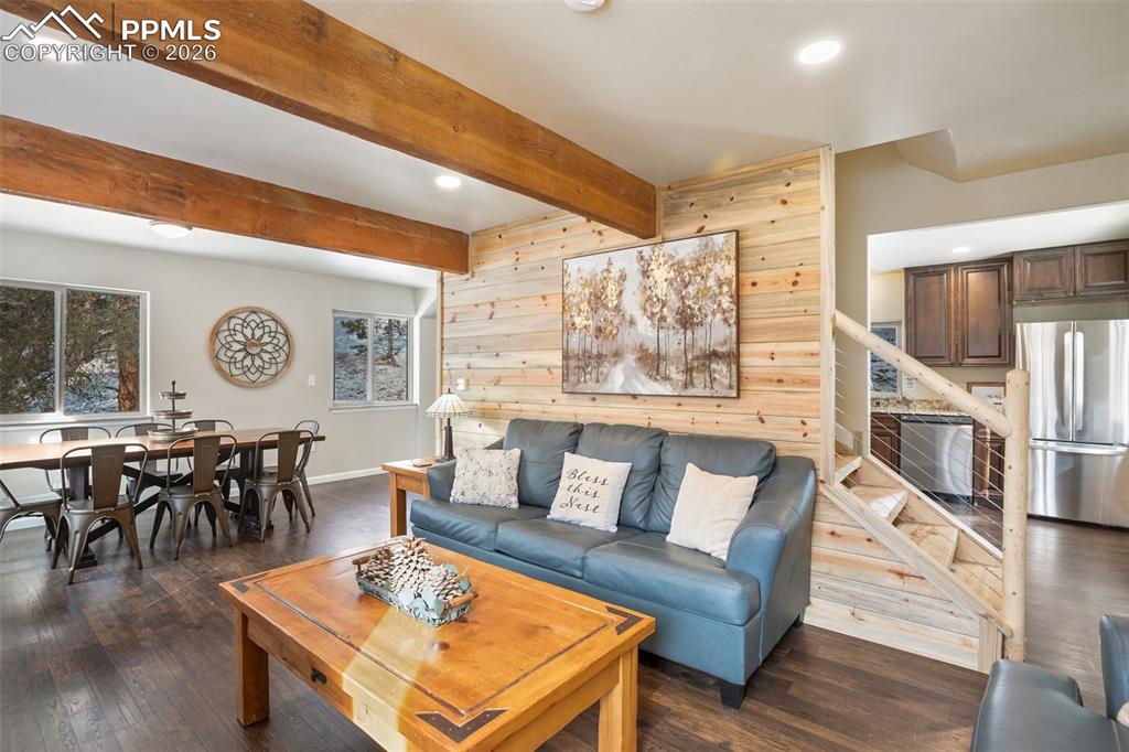 Image 7 of 38: Main level living room, dining room and kitchen