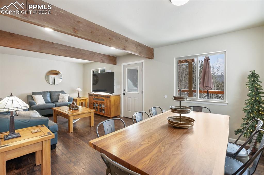 Image 8 of 38: Main level living room and dining 