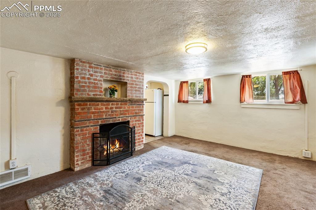 Image 18 of 34: Basement apartment living room